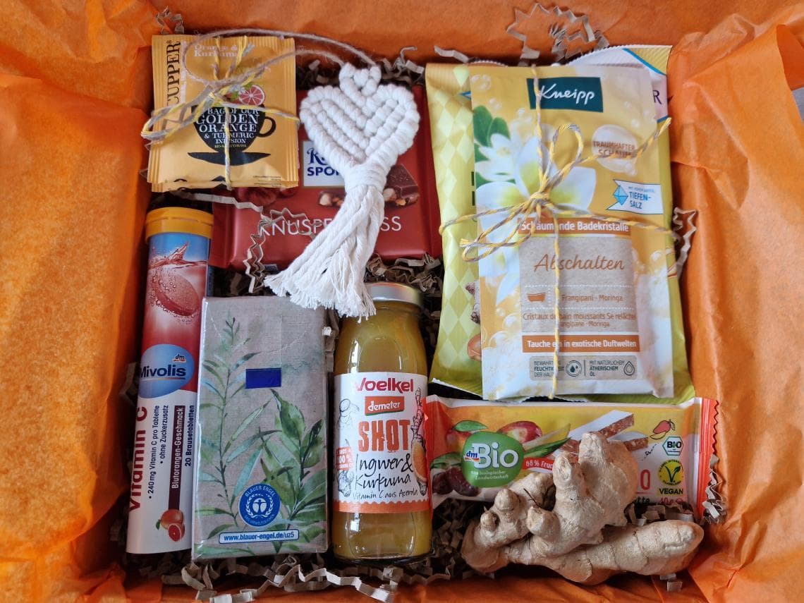 Genesungsbox mit Get Well Soon Karte und aufmunternden Produkten
